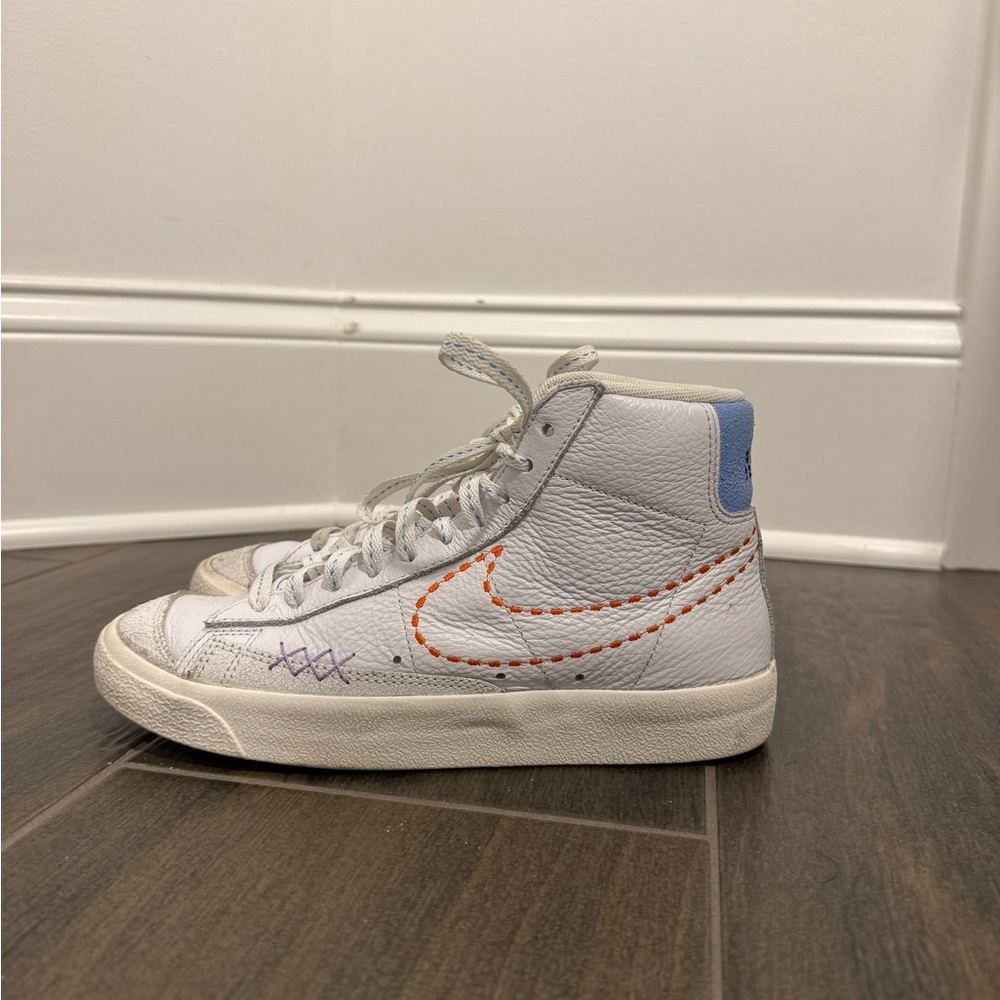 Nike White High-Tops with Orange and Blue Details